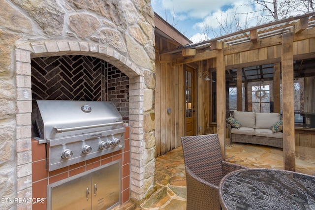 view of patio featuring area for grilling and an outdoor kitchen