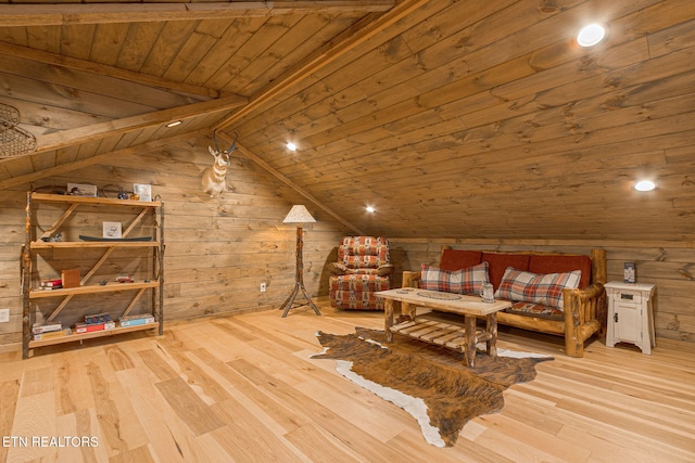 bedroom with wood ceiling, lofted ceiling with beams, wooden walls, and wood finished floors