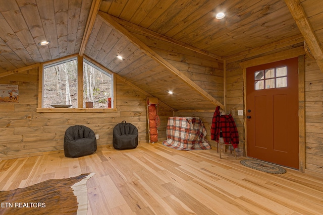 interior space with wooden walls and wooden ceiling