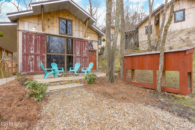 rear view of property featuring a patio