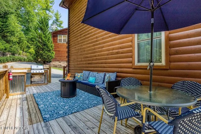 deck featuring outdoor lounge area and outdoor dining area