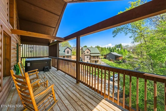 wooden deck featuring a residential view