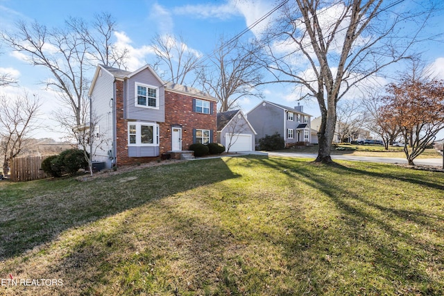 view of front of home with brick siding, a garage, a front lawn, and fence