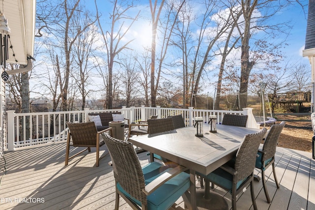 deck featuring outdoor dining area