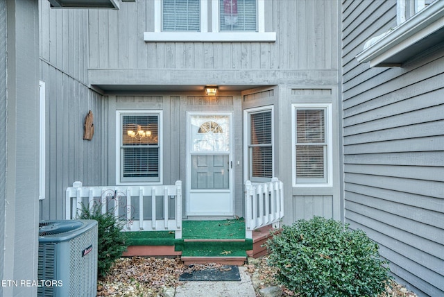 entrance to property featuring cooling unit