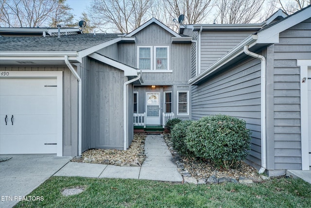 view of exterior entry featuring a garage