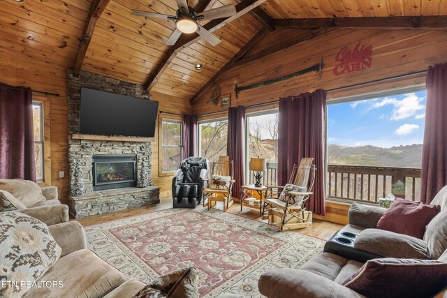 living room featuring plenty of natural light, wood ceiling, lofted ceiling with beams, and wood finished floors
