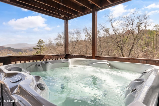 exterior details with a hot tub