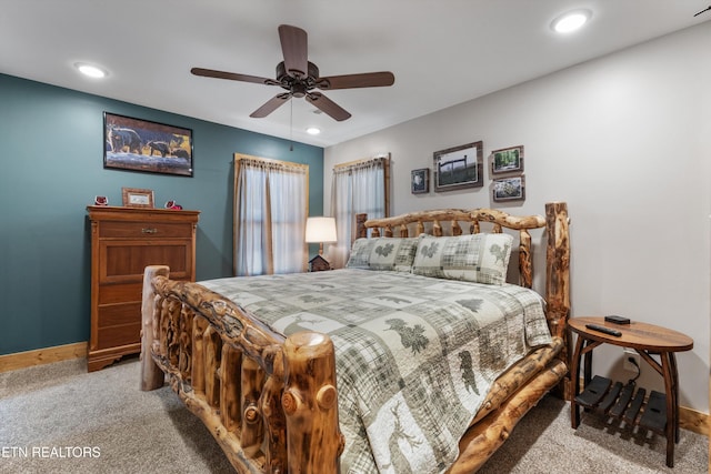 bedroom featuring a ceiling fan, recessed lighting, light colored carpet, and baseboards