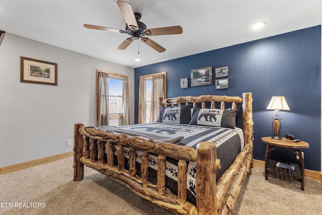 bedroom with carpet flooring, baseboards, and ceiling fan
