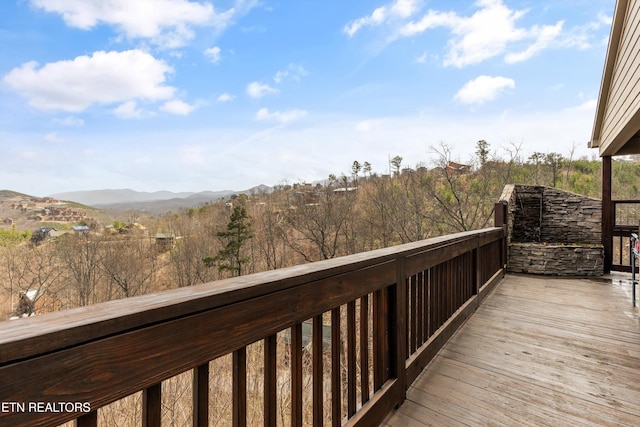wooden terrace featuring a mountain view