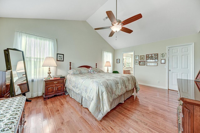 bedroom featuring a ceiling fan, baseboards, light wood finished floors, visible vents, and lofted ceiling