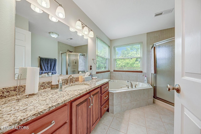 bathroom featuring visible vents, a stall shower, tile patterned floors, a tub with jets, and vanity