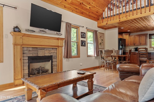 living room featuring wooden ceiling, light wood-style flooring, and baseboards