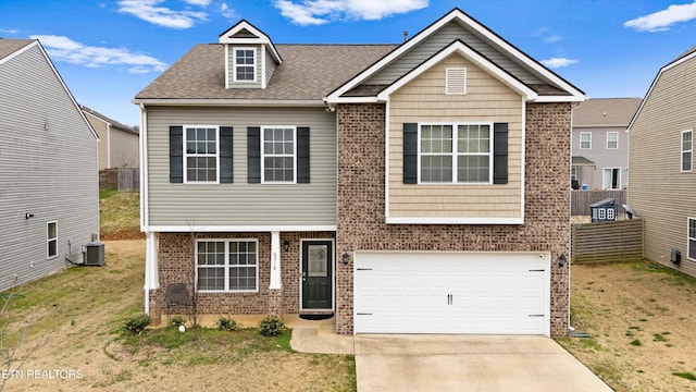 view of front of property with brick siding, concrete driveway, and a front lawn