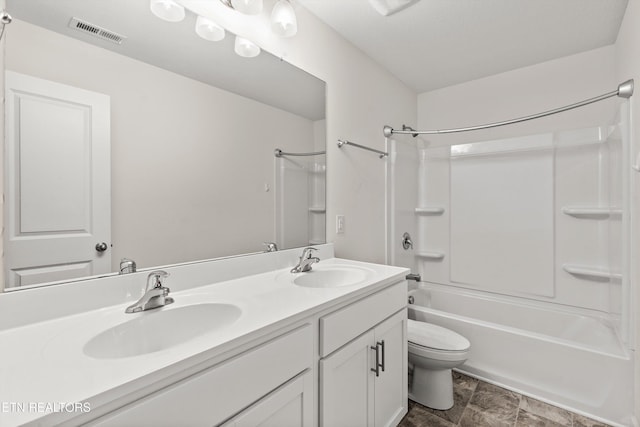 full bath with double vanity, toilet, visible vents, and a sink