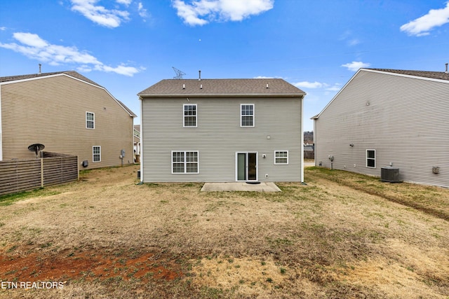 back of property featuring a patio area, central air condition unit, and a yard