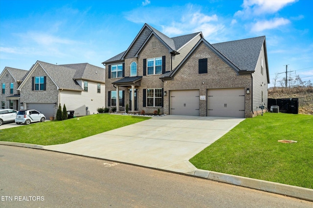 view of front of property featuring central air condition unit, a front lawn, concrete driveway, an attached garage, and brick siding