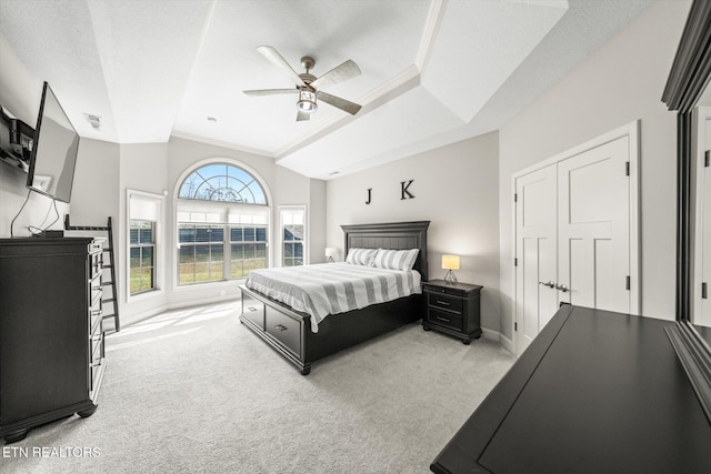 bedroom featuring ceiling fan, ornamental molding, baseboards, and light carpet