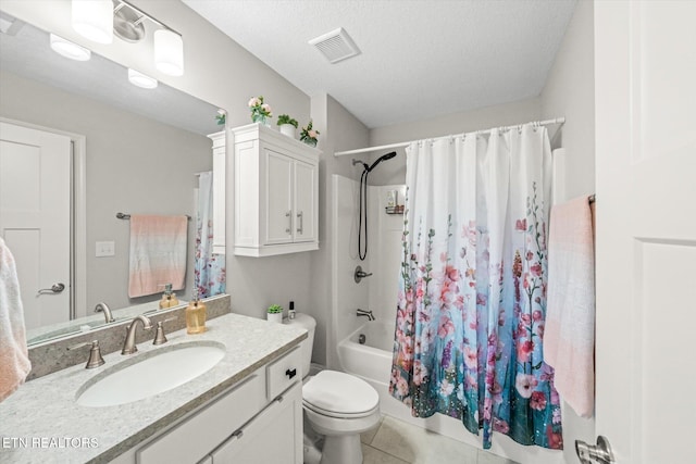 full bath with visible vents, toilet, tile patterned floors, shower / bath combination with curtain, and a textured ceiling