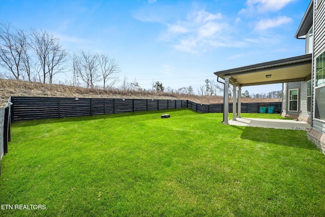 view of yard featuring a patio and a fenced backyard