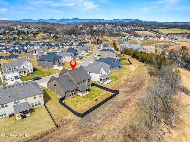 drone / aerial view with a residential view and a mountain view