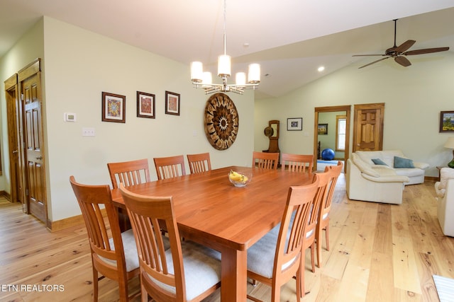 dining room featuring recessed lighting, light wood-style flooring, ceiling fan with notable chandelier, and lofted ceiling