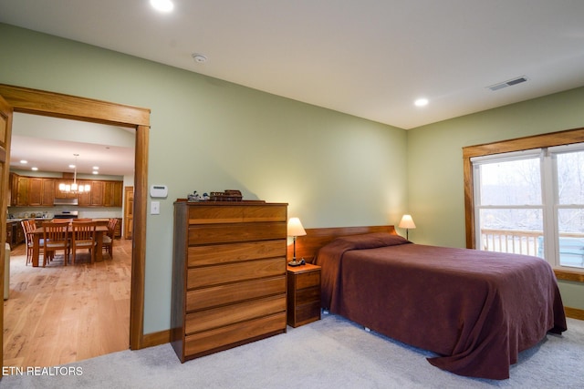 bedroom featuring visible vents, recessed lighting, light colored carpet, and baseboards