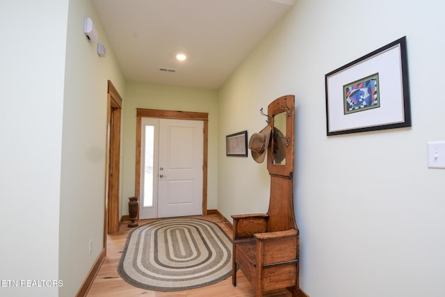 interior space with light wood finished floors, visible vents, recessed lighting, and baseboards