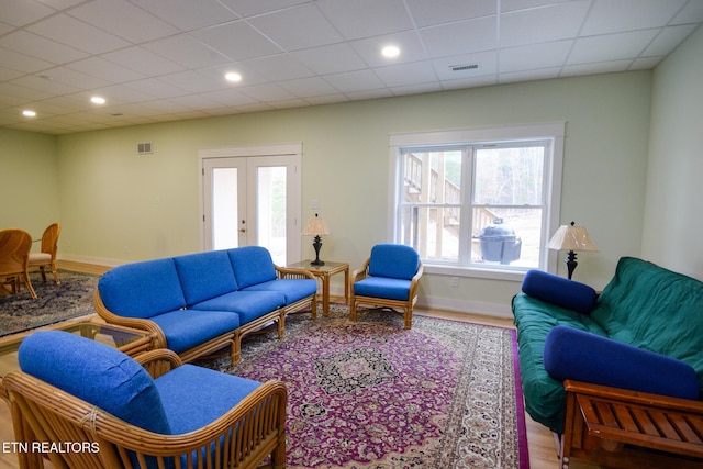 living area featuring recessed lighting, french doors, baseboards, and visible vents