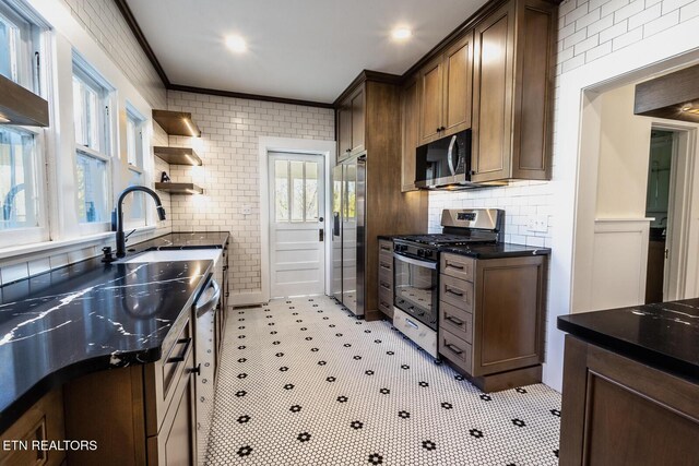 717 N Charles Seivers Blvd, Clinton, TN 37716 - kitchen featuring a sink, open shelves, crown molding, stainless steel appliances, and tasteful backsplash