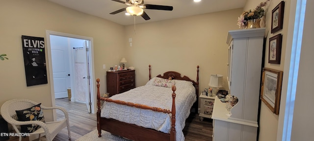 bedroom featuring connected bathroom, ceiling fan, and wood finished floors