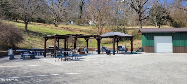 view of home's community featuring a pergola