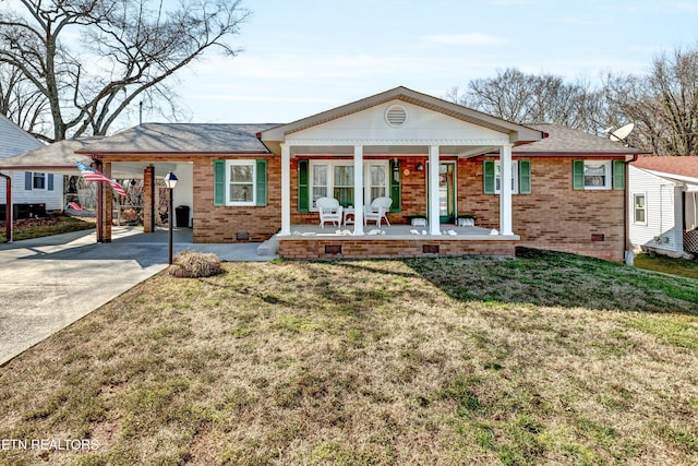 ranch-style home with brick siding, a porch, concrete driveway, and a front lawn