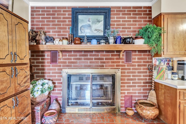 details featuring visible vents, a fireplace, and crown molding