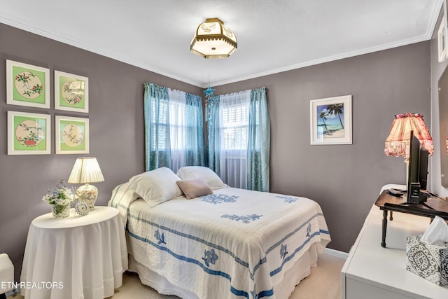 bedroom with light carpet, baseboards, and ornamental molding