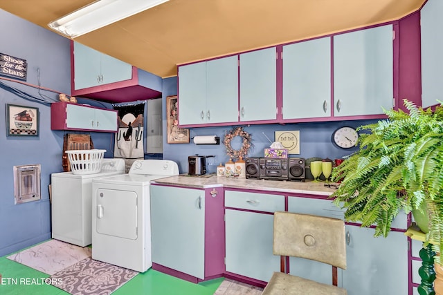 clothes washing area with separate washer and dryer