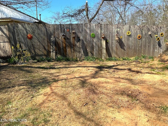 view of yard with fence