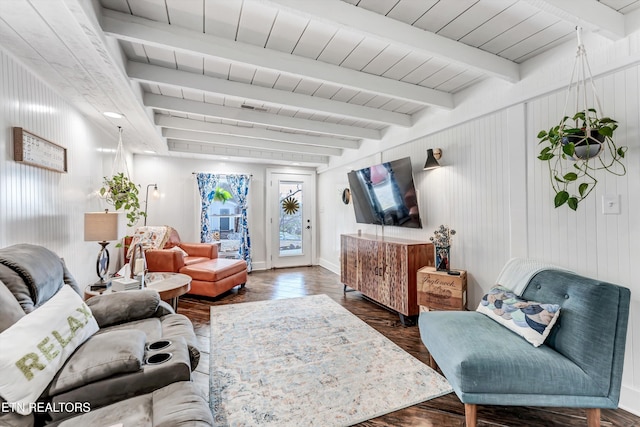 living area with beam ceiling, wood ceiling, and wood finished floors