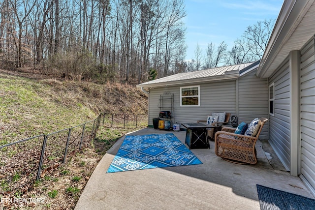 view of patio / terrace with outdoor lounge area and fence