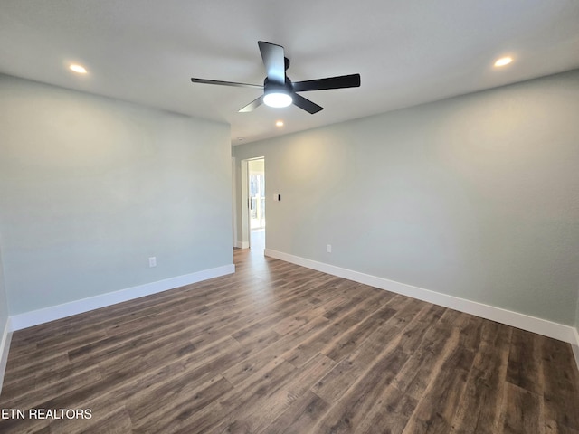 empty room featuring recessed lighting, baseboards, dark wood finished floors, and ceiling fan