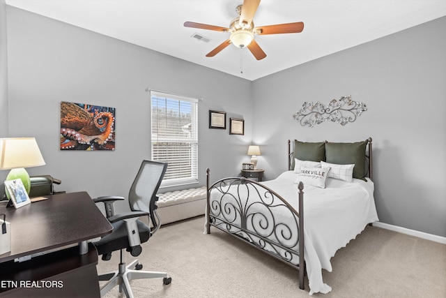 bedroom with visible vents, light carpet, baseboards, and a ceiling fan