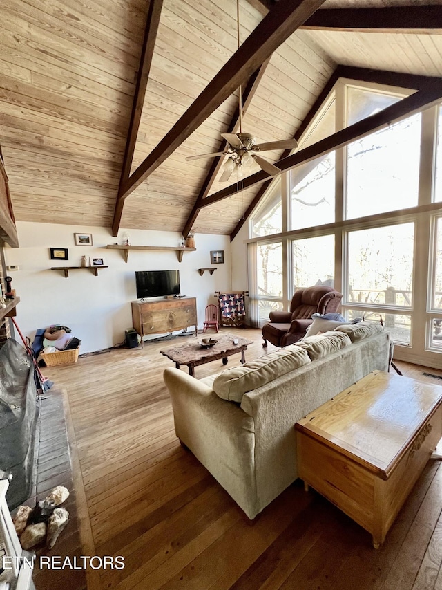 living room with high vaulted ceiling, ceiling fan, hardwood / wood-style flooring, wood ceiling, and beamed ceiling