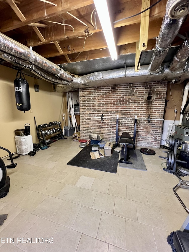 workout area with brick wall