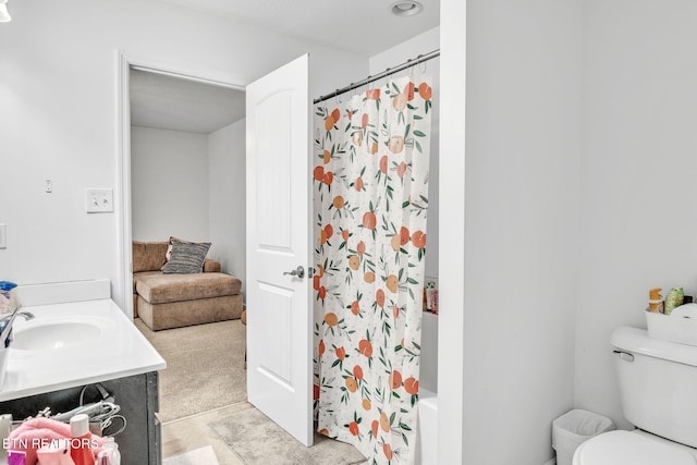 full bath featuring vanity, toilet, and shower / bath combo with shower curtain