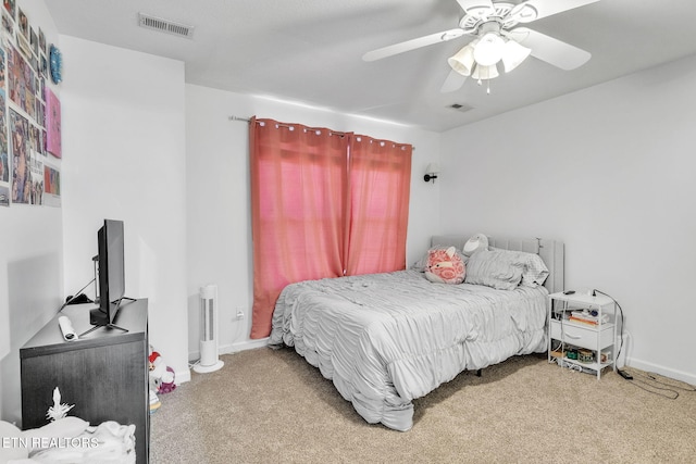 bedroom featuring a ceiling fan, carpet, visible vents, and baseboards