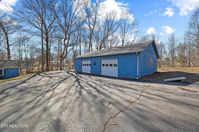 detached garage with fence