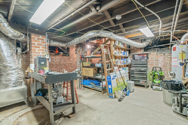 unfinished below grade area with brick wall and water heater