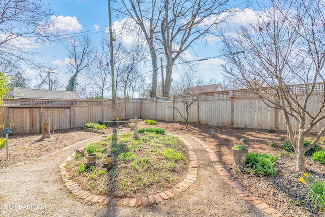 view of yard with a fenced backyard