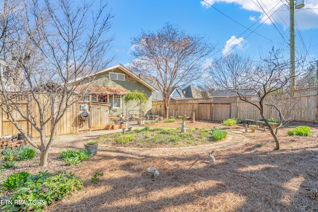 view of yard featuring a fenced backyard